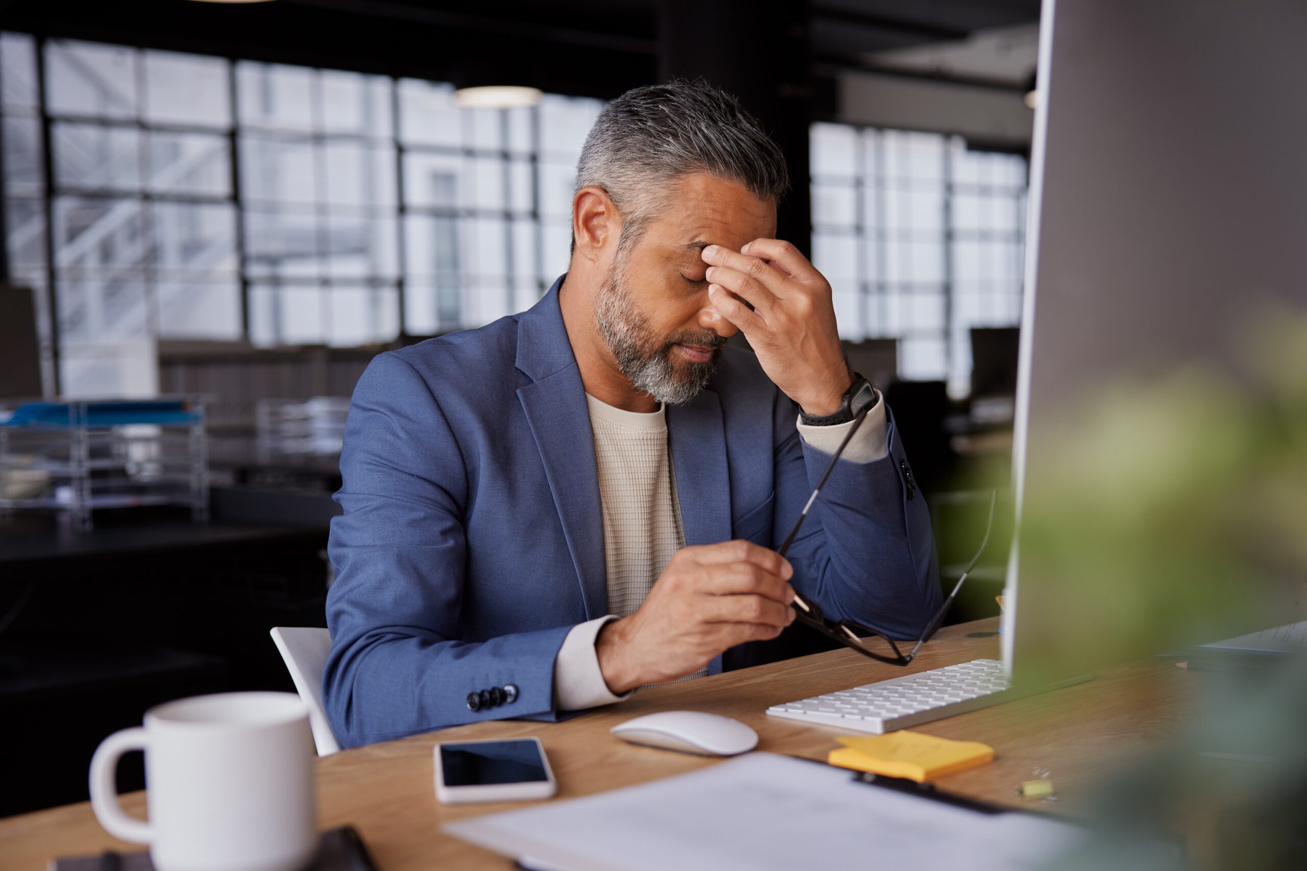 Mature,Businessman,Holding,His,Head,In,Stress,Indian,Manager,Working Stressed Executive
